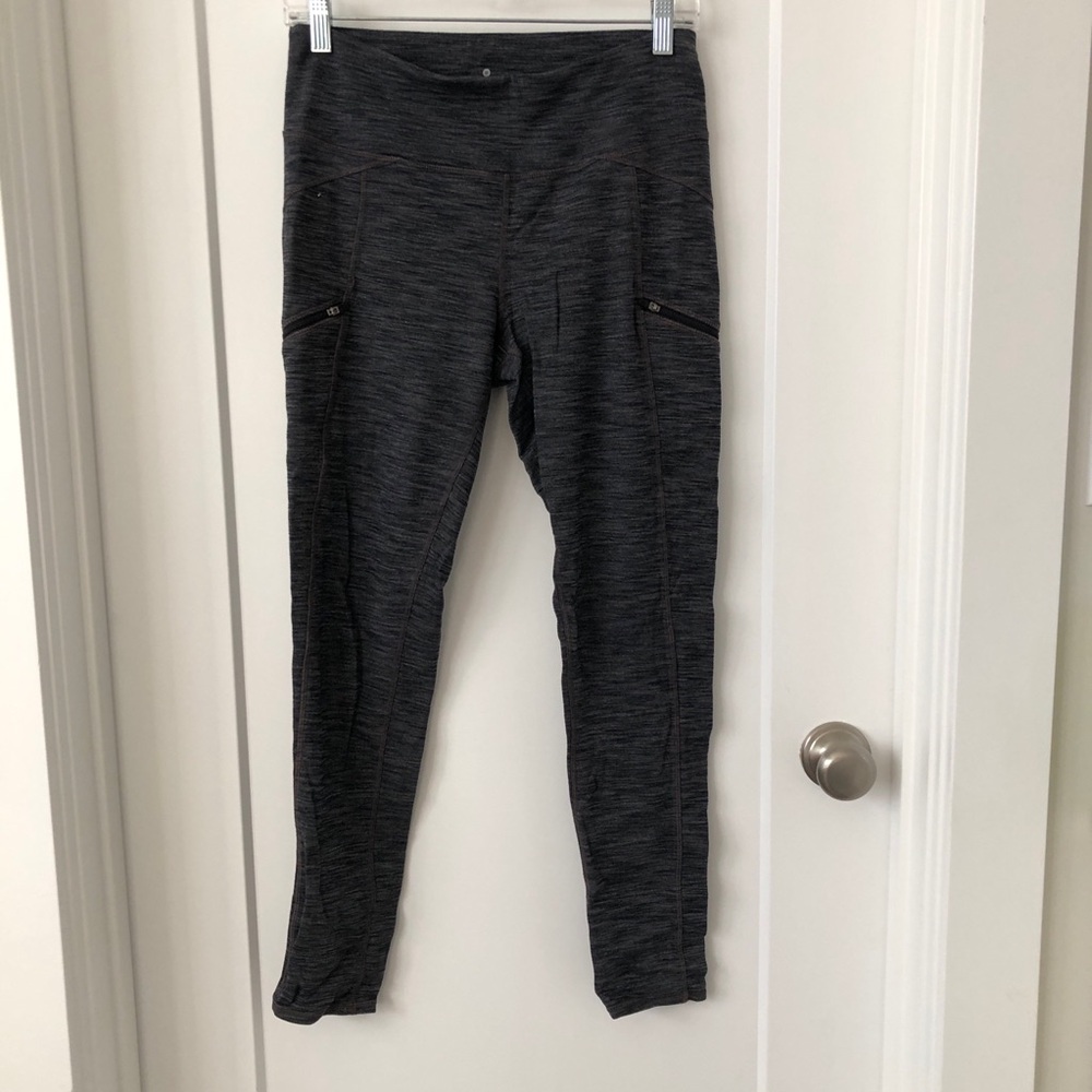 ATHLETA high waist leggings in dark grey/black with zip pockets.
